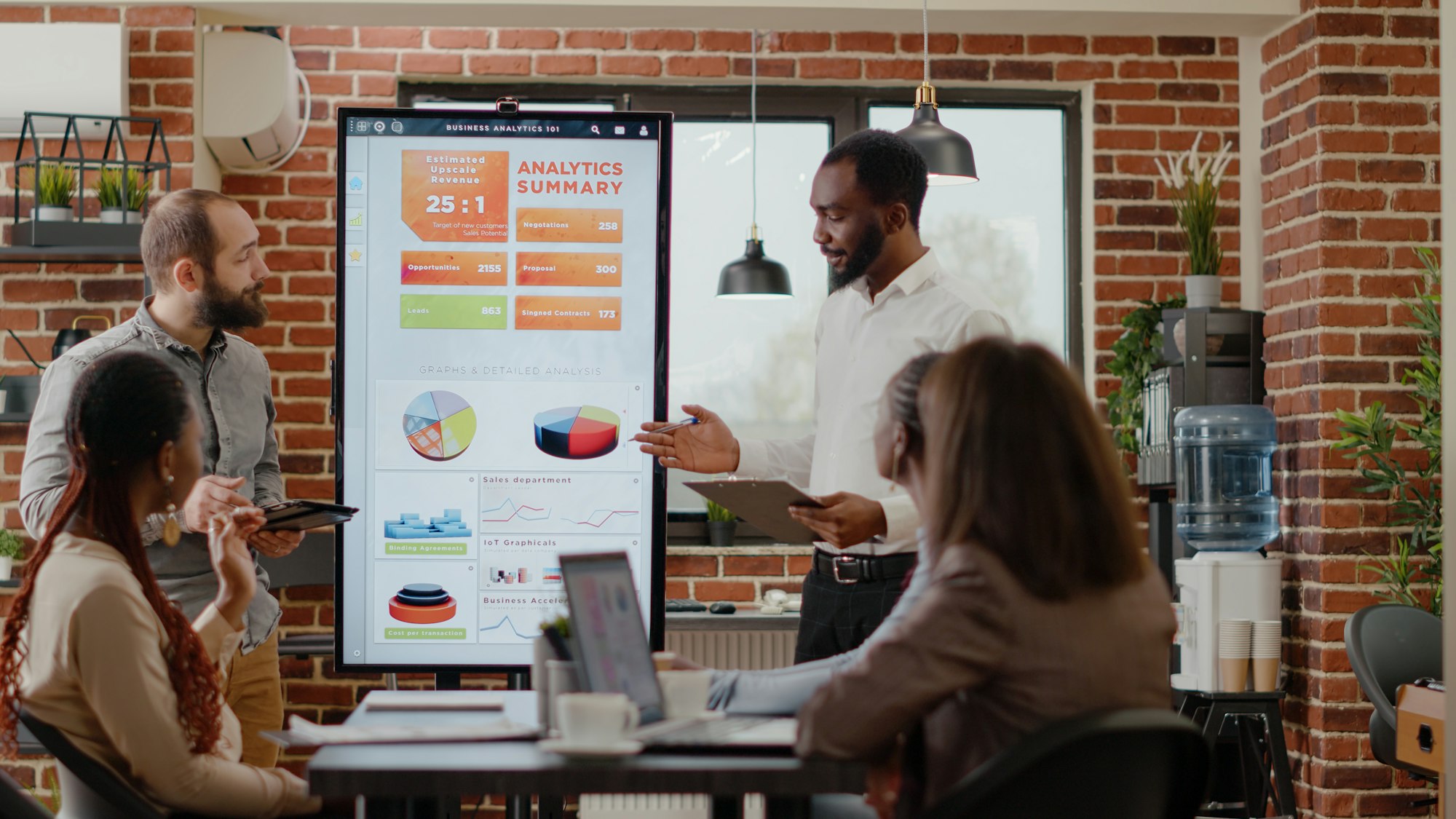 Team of people explaining marketing strategy with charts analysis